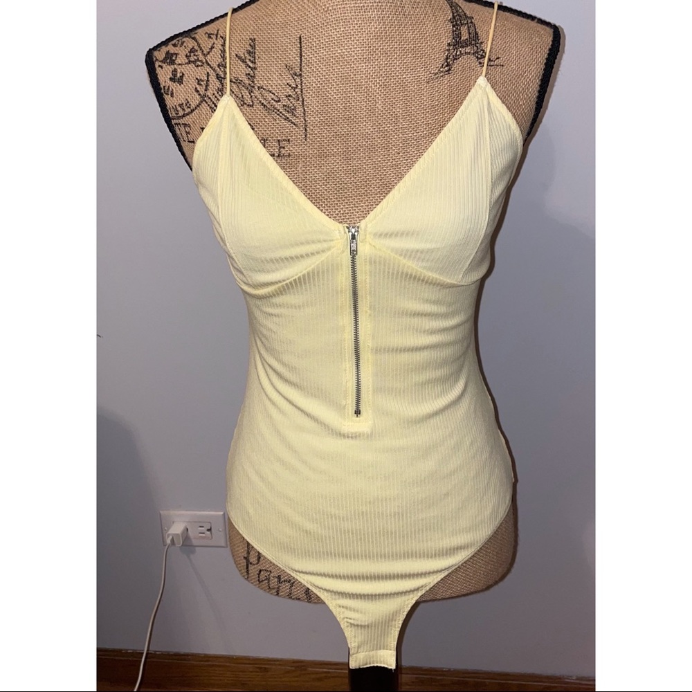 Pale yellow bodysuit